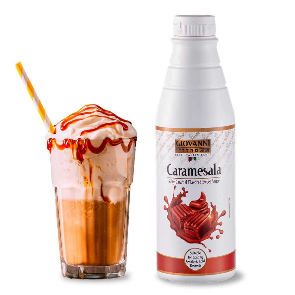 A tall iced coffee with whipped cream and a drizzle of Caramesala Salted Caramel Gourmet Sauce 1kg is a sensory delight. The striped orange and white straw matches the elegant bottle, featuring striking red and brown labels.