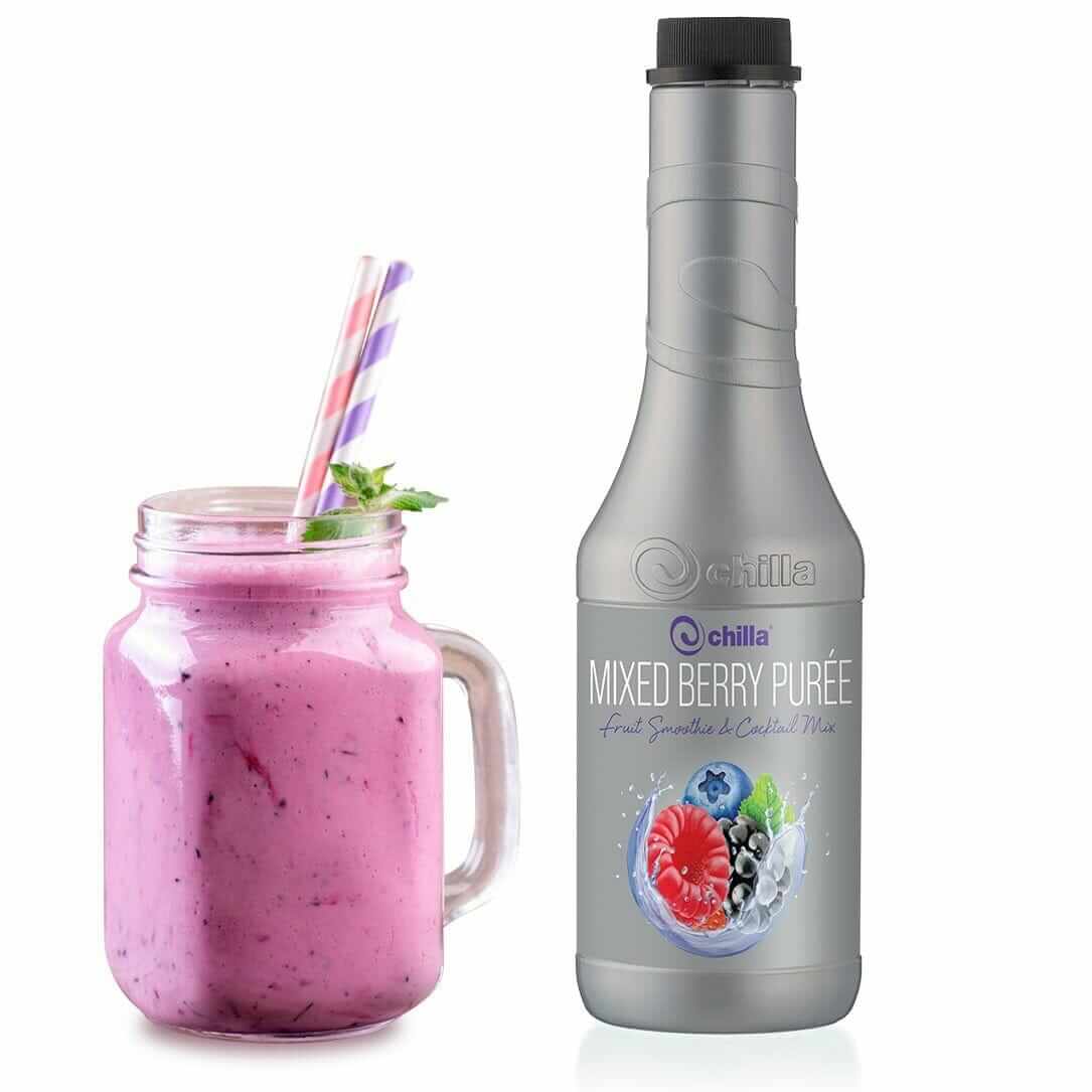 A jar of pink berry smoothie, garnished with mint and striped straws, sits next to a 1lt Chilla Mixed Berry Smoothie bottle featuring vibrant images of red, blue, and blackberries.