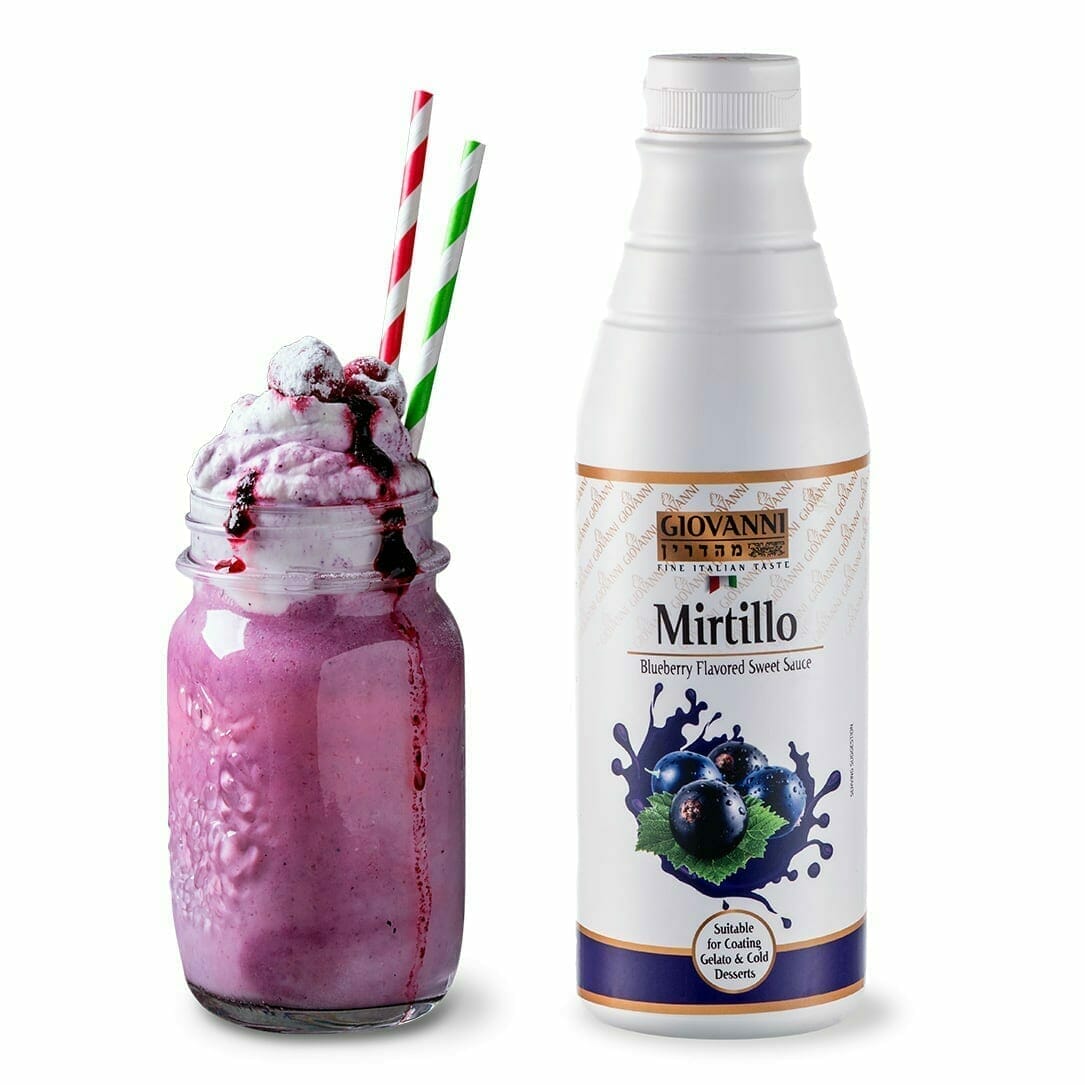 A mason jar overflows with a creamy blueberry smoothie, topped with whipped cream and a drizzle of Mirtillo Blueberry Gourmet Sauce, garnished with fresh blueberries and striped straws. Beside it is a "Mirtillo Blueberry Gourmet Sauce 1kg" bottle featuring vibrant blueberry imagery.