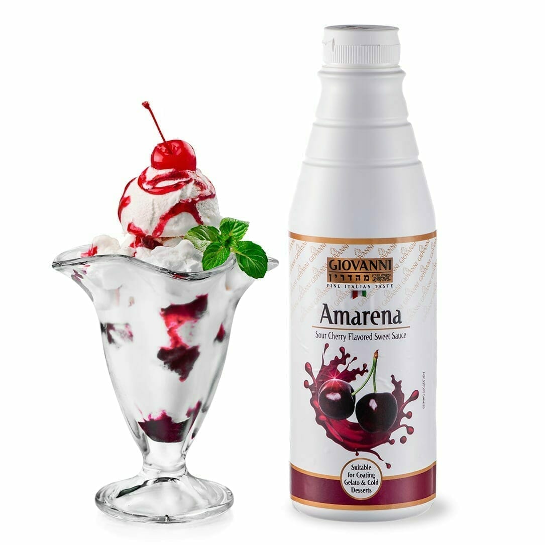 A glass sundae dish with vanilla ice cream, topped with a cherry and drizzled with Amarena Sour Cherry Sauce, is paired with a sprig of mint. Next to it stands the product's bottle, featuring cherries on a white label accented in gold.